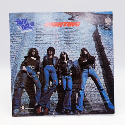 61 - THIN LIZZY VINYL ALBUMS (4)
(Three UK issues Plus One German issue). Fighting (Nice Price reissue), ... 