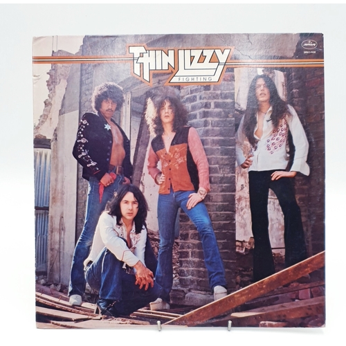 61 - THIN LIZZY VINYL ALBUMS (4)
(Three UK issues Plus One German issue). Fighting (Nice Price reissue), ... 