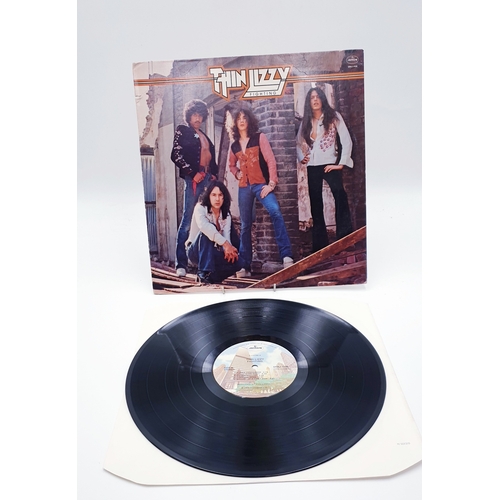 61 - THIN LIZZY VINYL ALBUMS (4)
(Three UK issues Plus One German issue). Fighting (Nice Price reissue), ... 