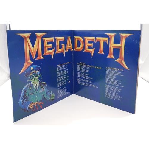 125 - HEAVY METAL VINYL ALBUMS Plus 12 inch (4)
(Three Lps and One 12 inch.)
( Helloween Lp+ inner. Ratt L... 