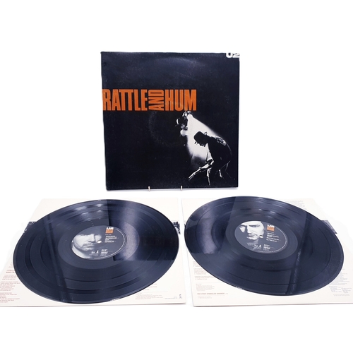 127 - U2 VINYL ALBUMS Plus 12 inch (3)
(Two Lps Plus One 12 inch.)
(Rattle and Hum gatefold 2Lp + inners. ... 