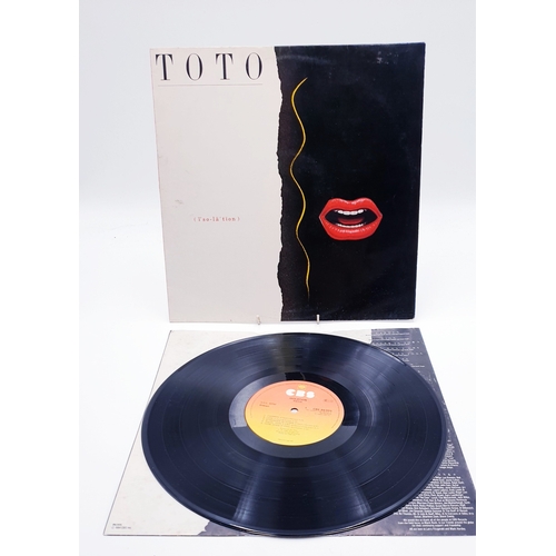 128 - TOTO VINYL ALBUMS Plus 12 inch (4)
(Three Albums Plus One 12 inch.)
( Isolation Lp+ inner. Toto Lp a... 