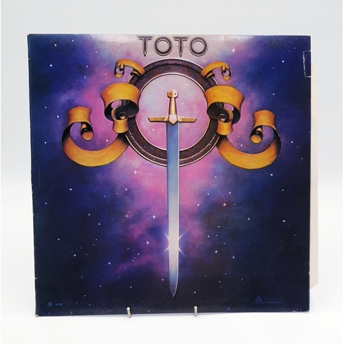 128 - TOTO VINYL ALBUMS Plus 12 inch (4)
(Three Albums Plus One 12 inch.)
( Isolation Lp+ inner. Toto Lp a... 