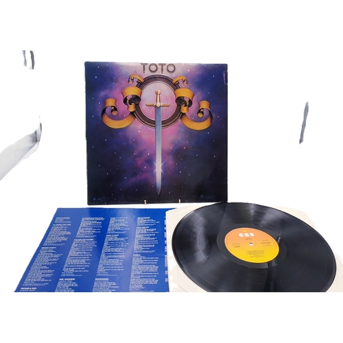 128 - TOTO VINYL ALBUMS Plus 12 inch (4)
(Three Albums Plus One 12 inch.)
( Isolation Lp+ inner. Toto Lp a... 