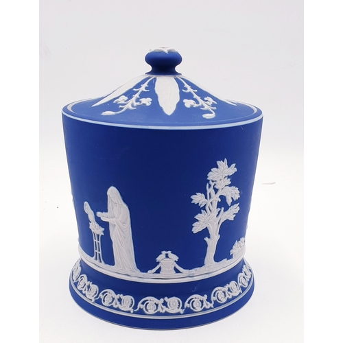 184 - WEDGWOOD DARK BLUE JASPER WARE 13.5cm BISCUIT BARREL