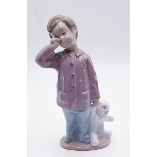 305 - LLADRO (Nao) 19cm x 12cm CHARACTER FIGURINE OF A YOUNG BOY With TEDDY BEAR 