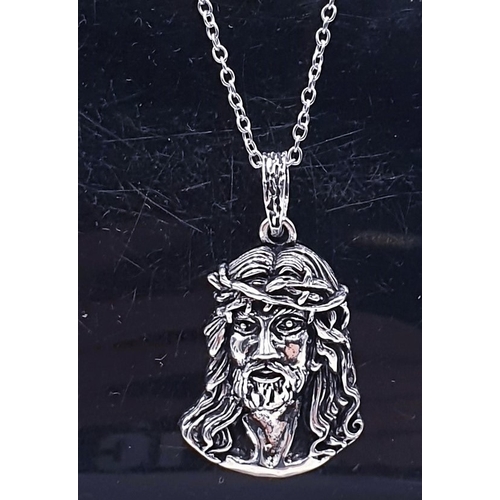 311 - WHITE METAL/SILVER PENDANT OF CHRIST ON A WHITE METAL /SILVER 50cm NECK CHAIN