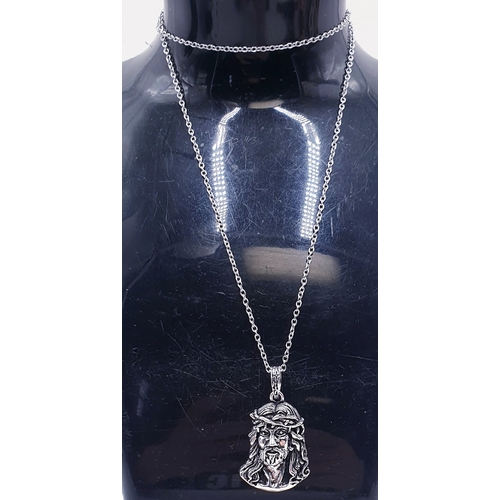 311 - WHITE METAL/SILVER PENDANT OF CHRIST ON A WHITE METAL /SILVER 50cm NECK CHAIN