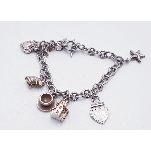 387 - SILVER (Hallmarked For London And Stamped J E) CHARM BRACELET And CHARMS By Well Known London Design... 