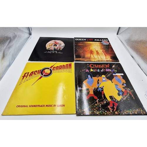 756 - QUEEN VINYL ALBUMS (4)
Flash + inner. A Day At The Races gatefold + Inner (USA issue). A Kind Of Mag... 