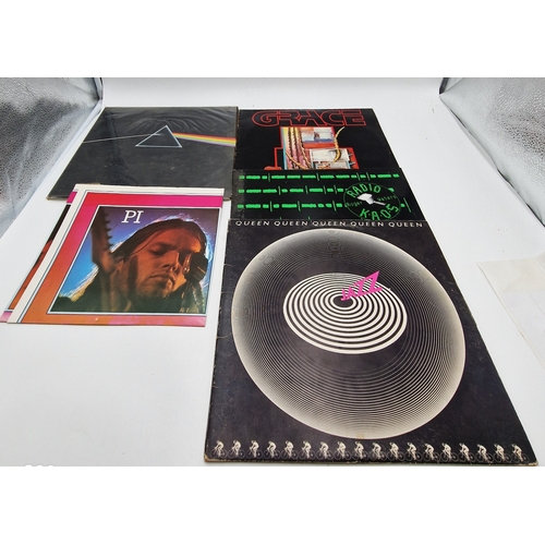 765 - ROCK VINYL ALBUMS (4)
Pink Floyd Dark Side Of The Moon gatefold LP +poster. Grace self-titled LP + i... 