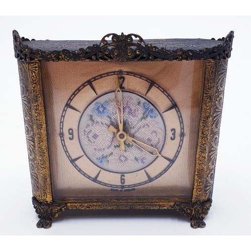 17 - ENGLISH GILT METAL 10.5cm x 10cm  CLOCK THE CENTRE IS LIKE A SAMPLER CLOTH  (Found To Be Working Whe... 