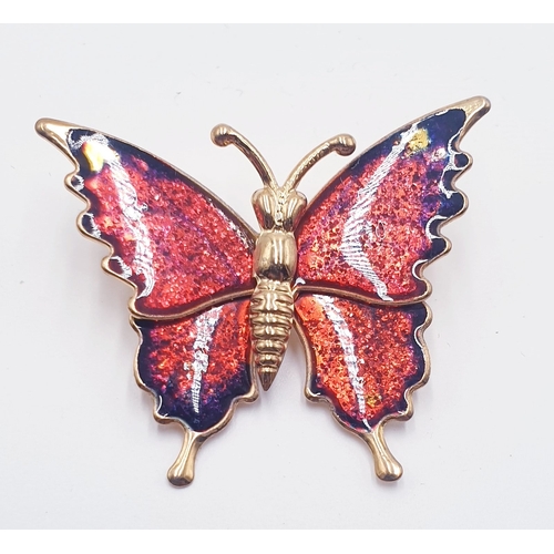 587 - YELLOW METAL & ENAMEL 4cm ARTICULATED BROOCH FASHIONED AS A BUTTERFLY