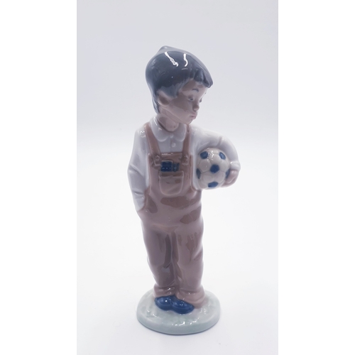 601 - LLADRO (Nao) PORCELAIN Large 18.5cm PORCELAIN CHARACTER FIGURINE OF A YOUNG BOY HOLDING A FOOTBALL 