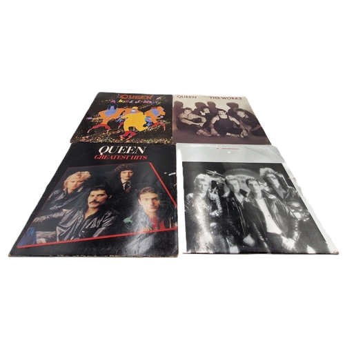 308 - QUEEN VINYL LPS (4)
A KIND OF MAGIC GATEFOLD SLEEVE + INNER./ THE WORKS + INNER./ GREATEST HITS + IN... 