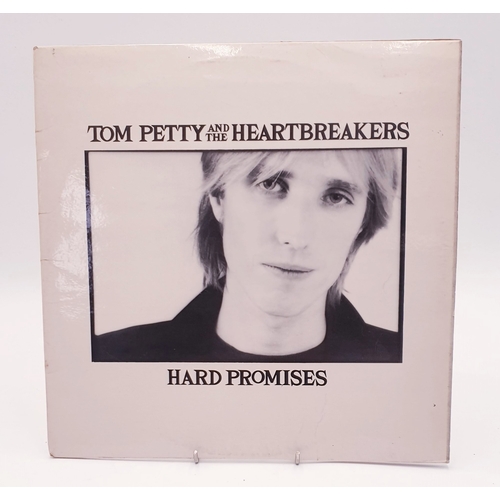 569 - TOM PETTY AND THE HEARTBREAKERS VINYL LP (1)
HARD PROMISES UK ISSUE WITH THE INNER AND LYRIC INSERT.... 