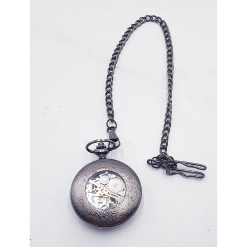 714 - MECHANICAL SKELETON TYPE POCKET WATCH (Found To Be Working When Photographed) ON A WATCH CHAIN