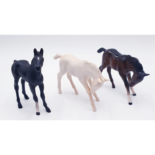 72 - BESWICK MODELS OF THREE FOALS