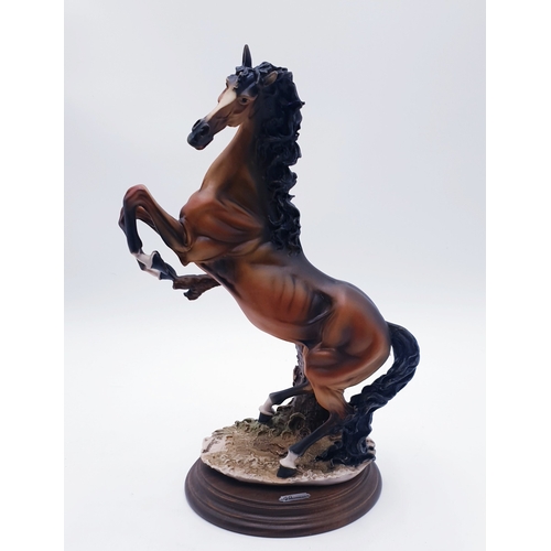 138 - CERAMIC Extra Large 33cm MODEL OF A RAMPANT REARING STALLION MOUNTED ON A POLISHED WOODEN PLYNTH Sig... 