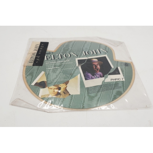 687 - ELTON JOHN SHAPED PICTURE DISC 7 INCH VINYL (1)
SAD SONGS (SAY SO MUCH) HAT SHAPED PICTURE DISC FROM... 