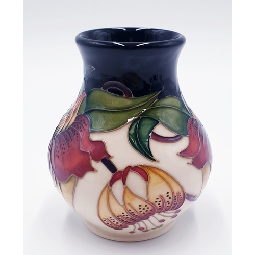 73 - MOORCROFT 10.2cm VASE (Shape No 869/4) IN THE ANNA LILY DESIGN By Designer Nicola Slaney R.R.P. £255... 