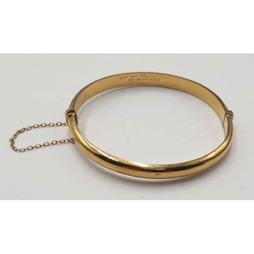 174 - 9ct ROLLED GOLD HINGED BANGLE (With Safety Chain)