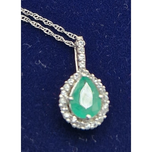 221 - 9ct WHITE GOLD (Stamped 9K) PENDANT With PEAR SHAPED EMERALD SURROUNED BY DIAMONDS ON A 9ct WHITE GO... 