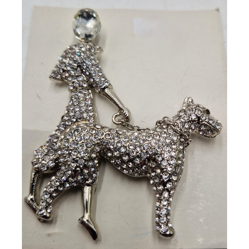 305 - WHITE METAL JEWELLED LADY And DOG BROOCH