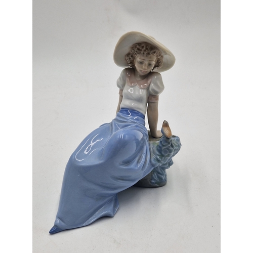 85 - LLADRO (Nao) Large 15cm x 16cm FIGURINE OF A GIRL LEANING AGAINST ROCK WATCHING A SMALL BIRD 'LISTEN... 