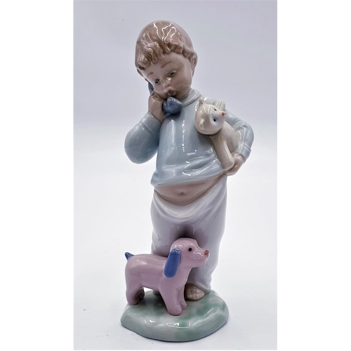 LLADRO (Nao) PORCELAIN 19cm CHARACTER FIGURINE OF A YOUNG BOY ON THE ...