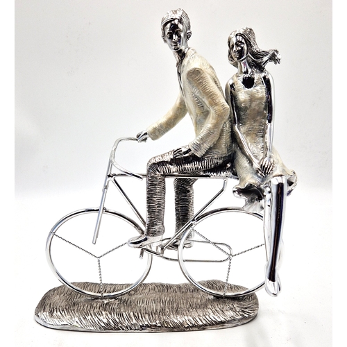 1058 - COMPOSITE Extra Large 33cm x 19cm SCULPTURE OF A LADY And GENTLEMAN RIDING A BICYCLE. (Please Note T... 