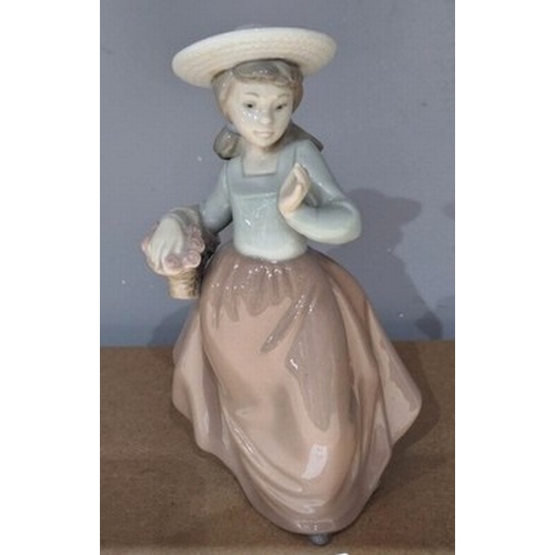 1042 - LLADRO (Nao) PORCELAIN 18cm CHARACTER FIGURINE OF A YOUNG GIRL WITH BASKET AND WEARING A BONNET