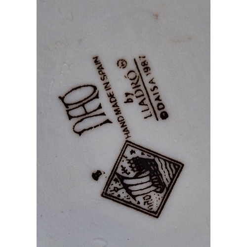 110 - LLADRO (Nao) Large 15cm x 16cm FIGURINE OF A GIRL LEANING AGAINST ROCK WATCHING A SMALL BIRD 'LISTEN... 