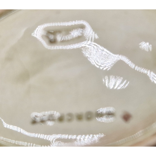 21 - MOORCROFT ASHTRAY IN THE HIBISCUS DESIGN ON GREEN GROUND