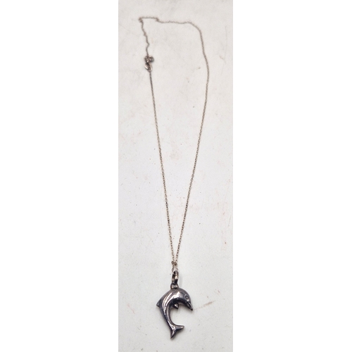 19 - SILVER (925) PENDANT FASHIONED AS A LEAPING DOLPHIN ON A SILVER (925) NECK CHAIN