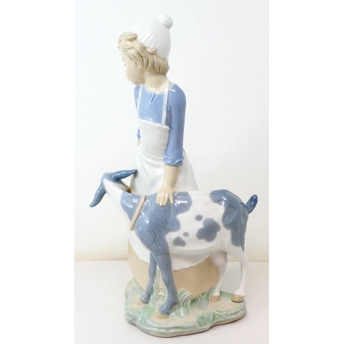 342 - LLADRO (Nao) PORCELAIN Extra Large 29cm CHARACTER FIGURINE OF A GIRL WITH GOAT.
(NAO pottery, a bran... 