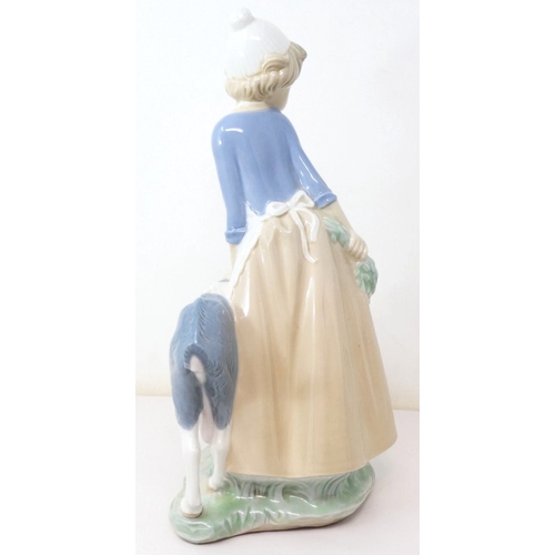 342 - LLADRO (Nao) PORCELAIN Extra Large 29cm CHARACTER FIGURINE OF A GIRL WITH GOAT.
(NAO pottery, a bran... 