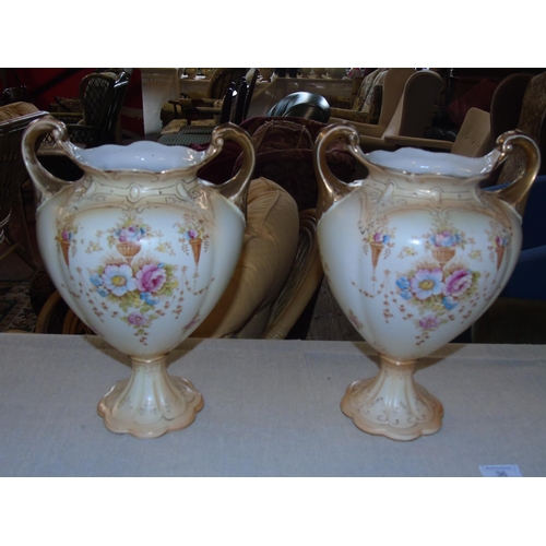 36 - A large pair of Crown Devon handled vases. 34 cm H