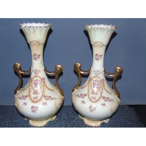 37 - A pair of Crown Devon ewers. 33cm tall