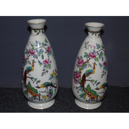 45 - A pair of hand painted Crown Devon vases. 25cm H