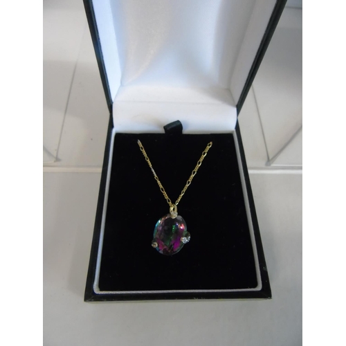 152 - A 9ct 20 inch figaro chain & mystic topaz & diamond pendant