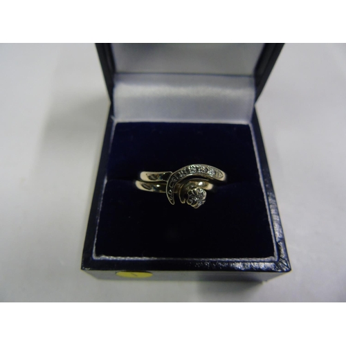 149 - A pair of 9ct gold & diamond interlocking rings size O & O 1/2