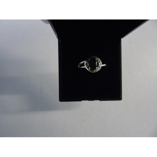 135 - A 9ct gold & diamond garnet halo ring size 0