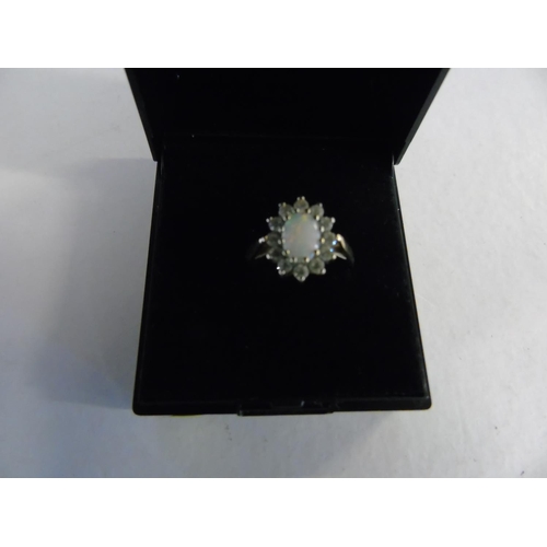 136 - A 9ct gold opal cluster ring size N
