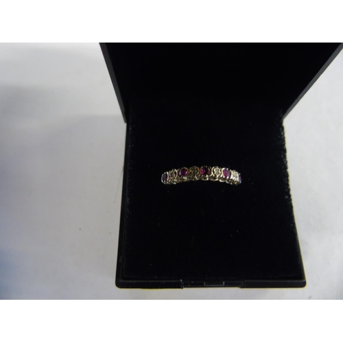 140 - A 9ct gold ruby & diamond eternity ring size J 1/4