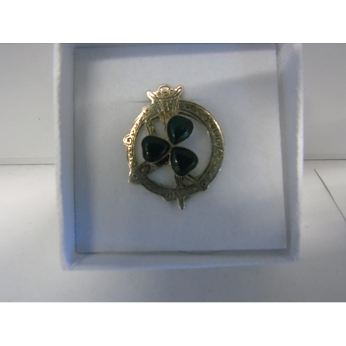 171 - An antique silver brooch with a jade shamrock