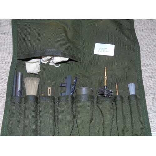 24 - A vintage gun cleaning kit