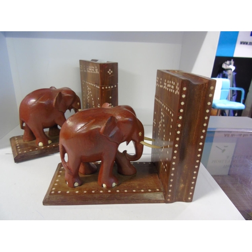 47 - A pair of hard wood elephant form book ends