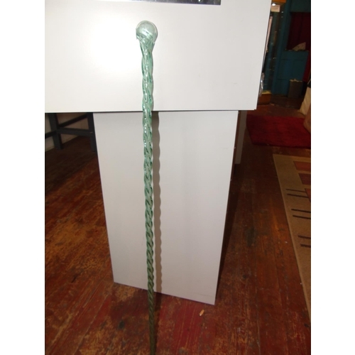 58 - An antique green twisted glass walking cane