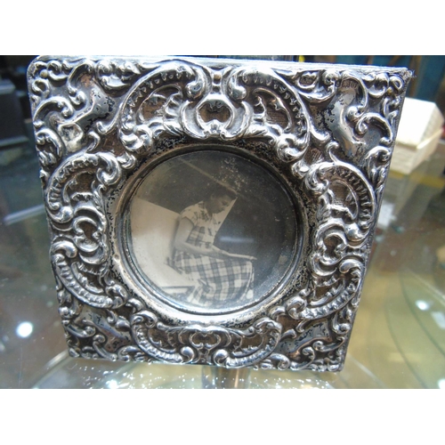 106 - A vintage silver photo frame with Birmingham hallmarks (flip out stand missing from back of frame)